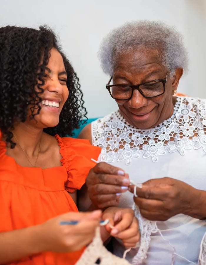 Caregiver and senior sharing a warm moment